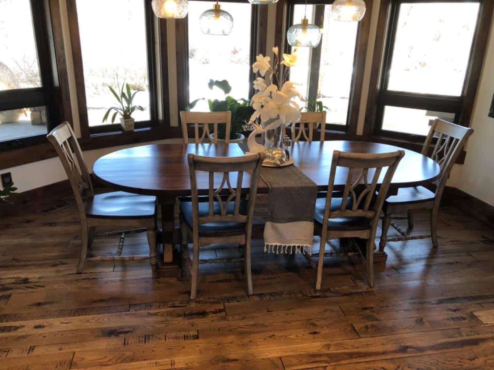 Dining room with custom woodwork and large windows