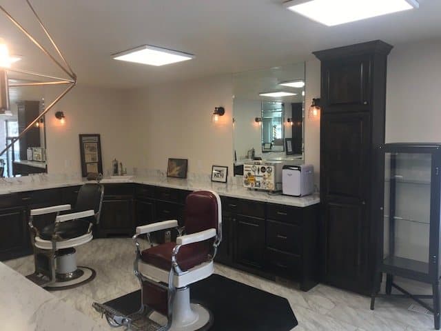 Custom barbershop build-out with barber stations and mirrors