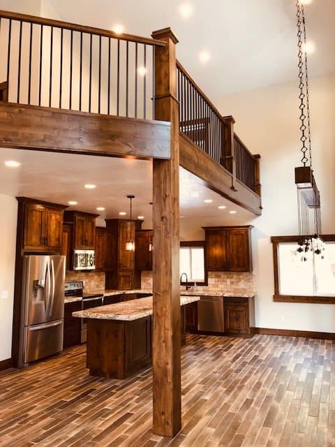 Built-in bunk beds with a ladder and TV niche