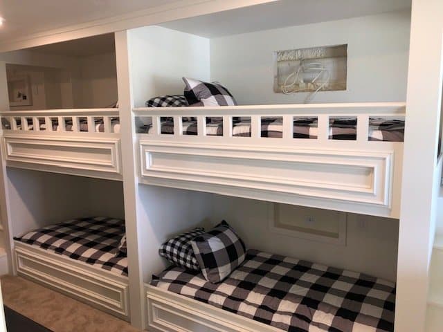 Built-in bunk beds with plaid bedding