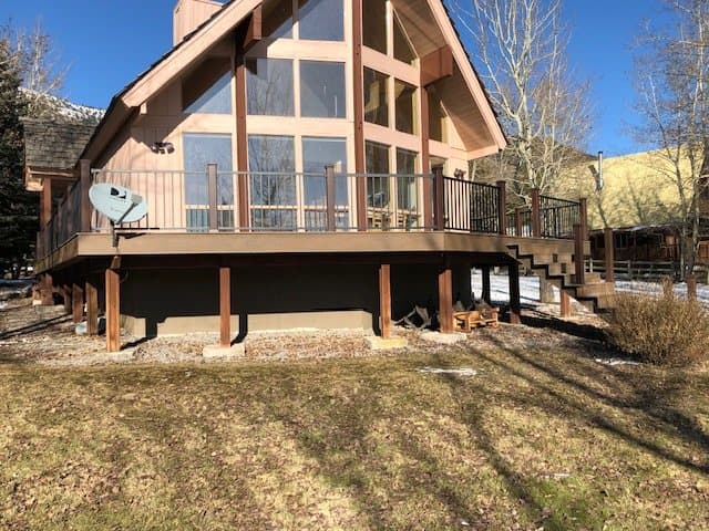 Large multi-level cedar deck with railings