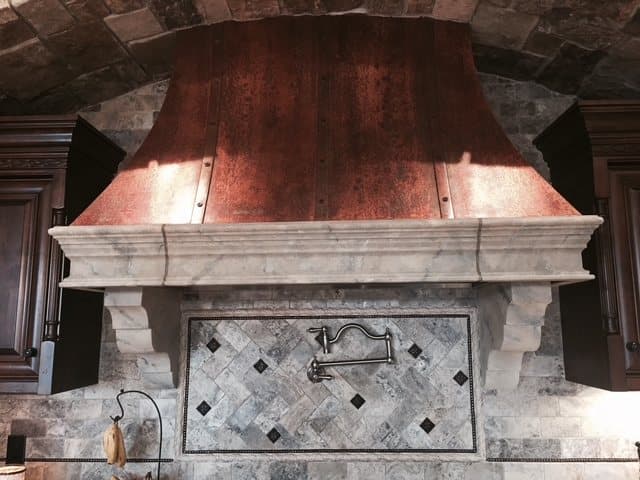 Polished copper range hood, front view