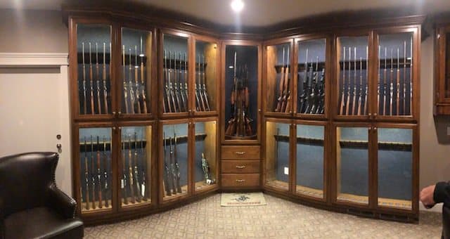 Wall of glass-front custom gun cabinets
