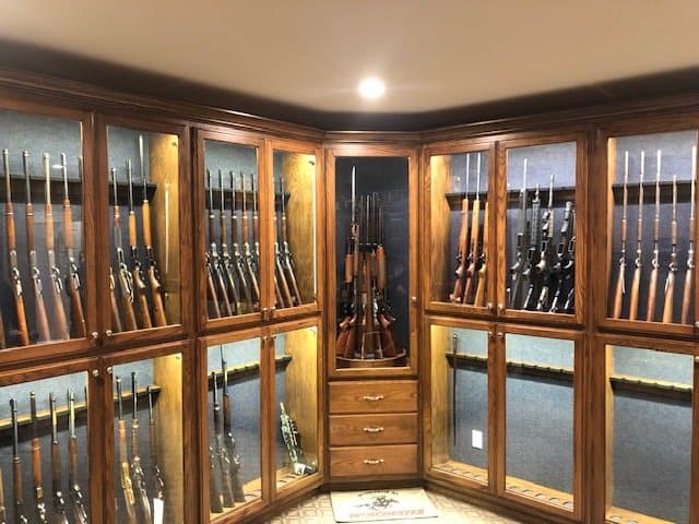 Custom walnut-and-glass gun display room