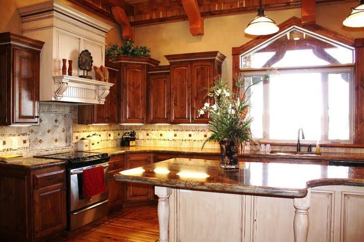 Rustic knotty-alder kitchen with a wood range hood