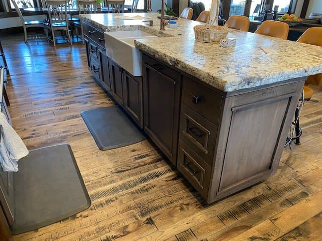 Blue-gray cabinetry with a granite island