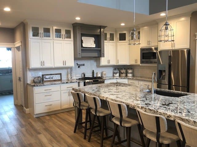 White custom kitchen with stainless appliances