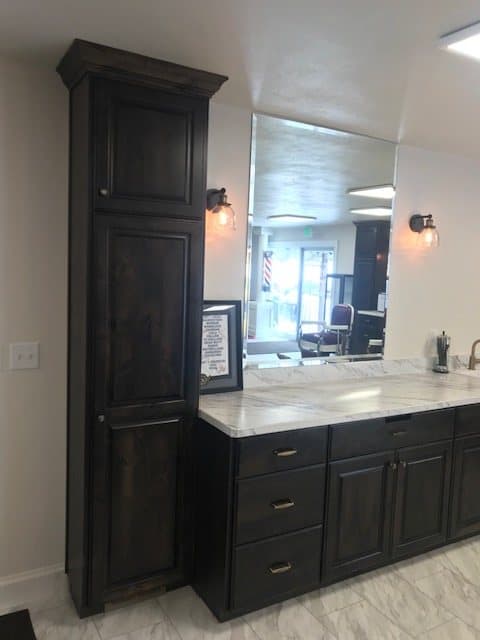 Dark commercial reception bar with a marble top